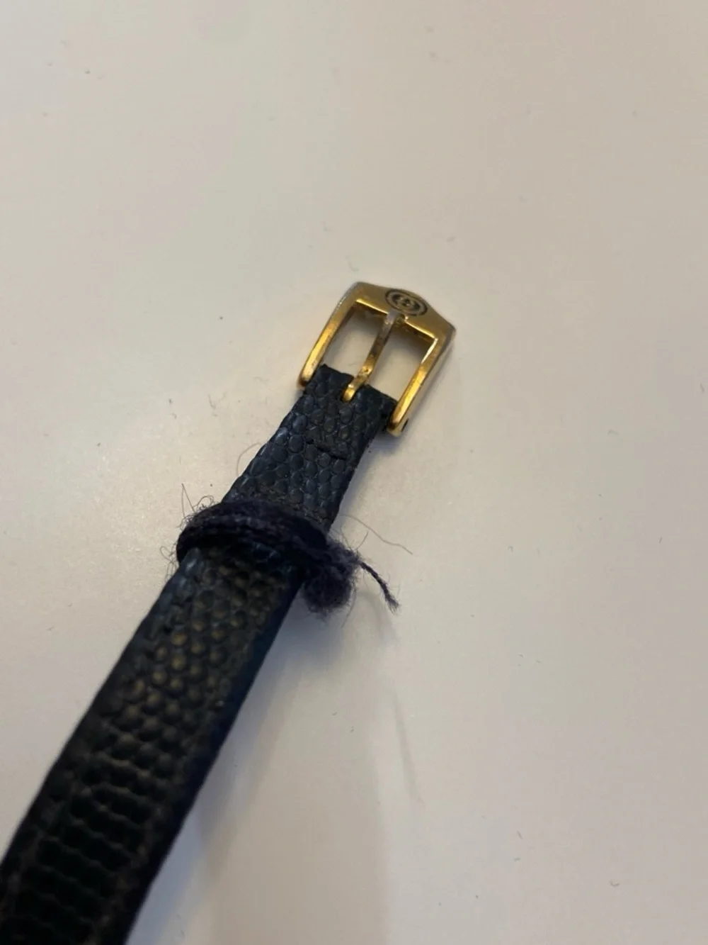 Gucci Black and Gold Round Dial Leather Strap Watch